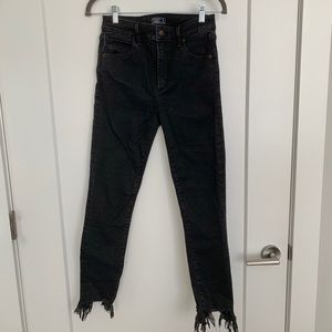 Black skinny jeans with fringe hem